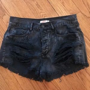 Distressed black jean shorts